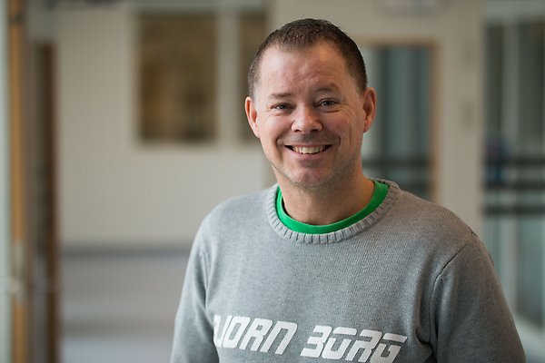 Portrait photo of Martin Andersson standing in a hall